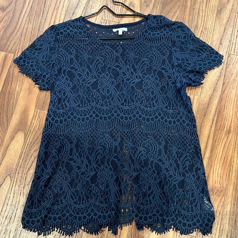 Sheer lace top with open back slit.